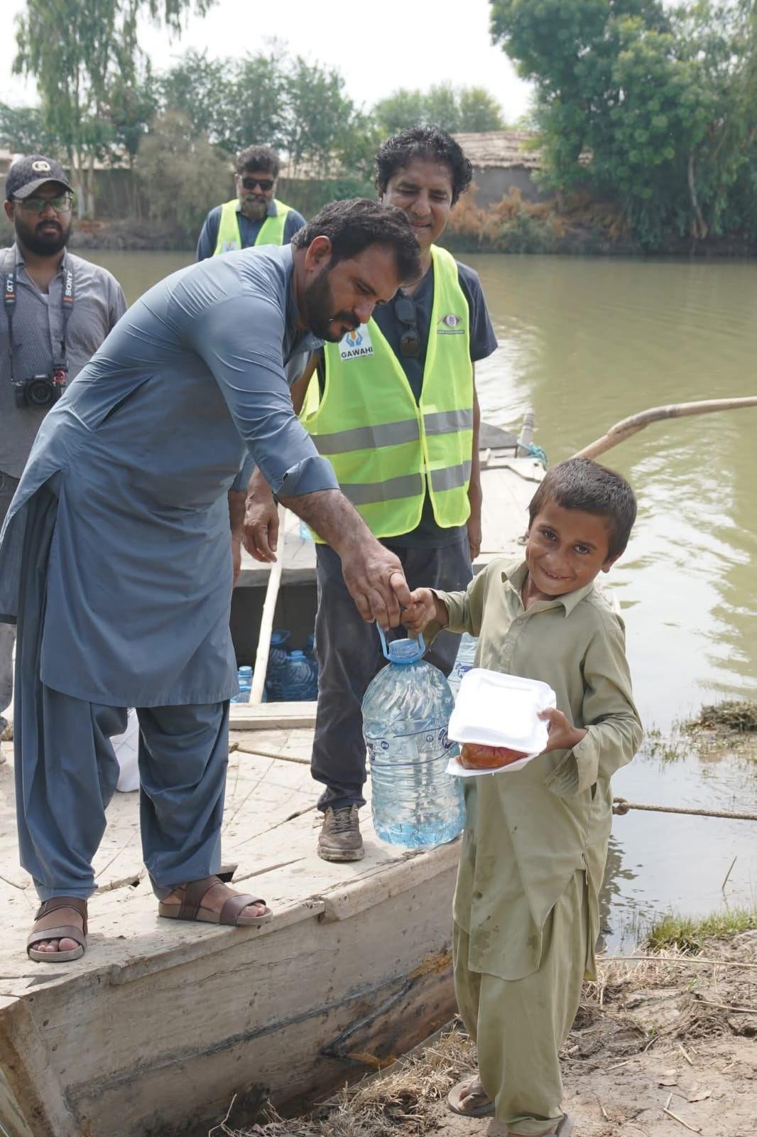 Boat-based flood relief distribution to a stranded family
