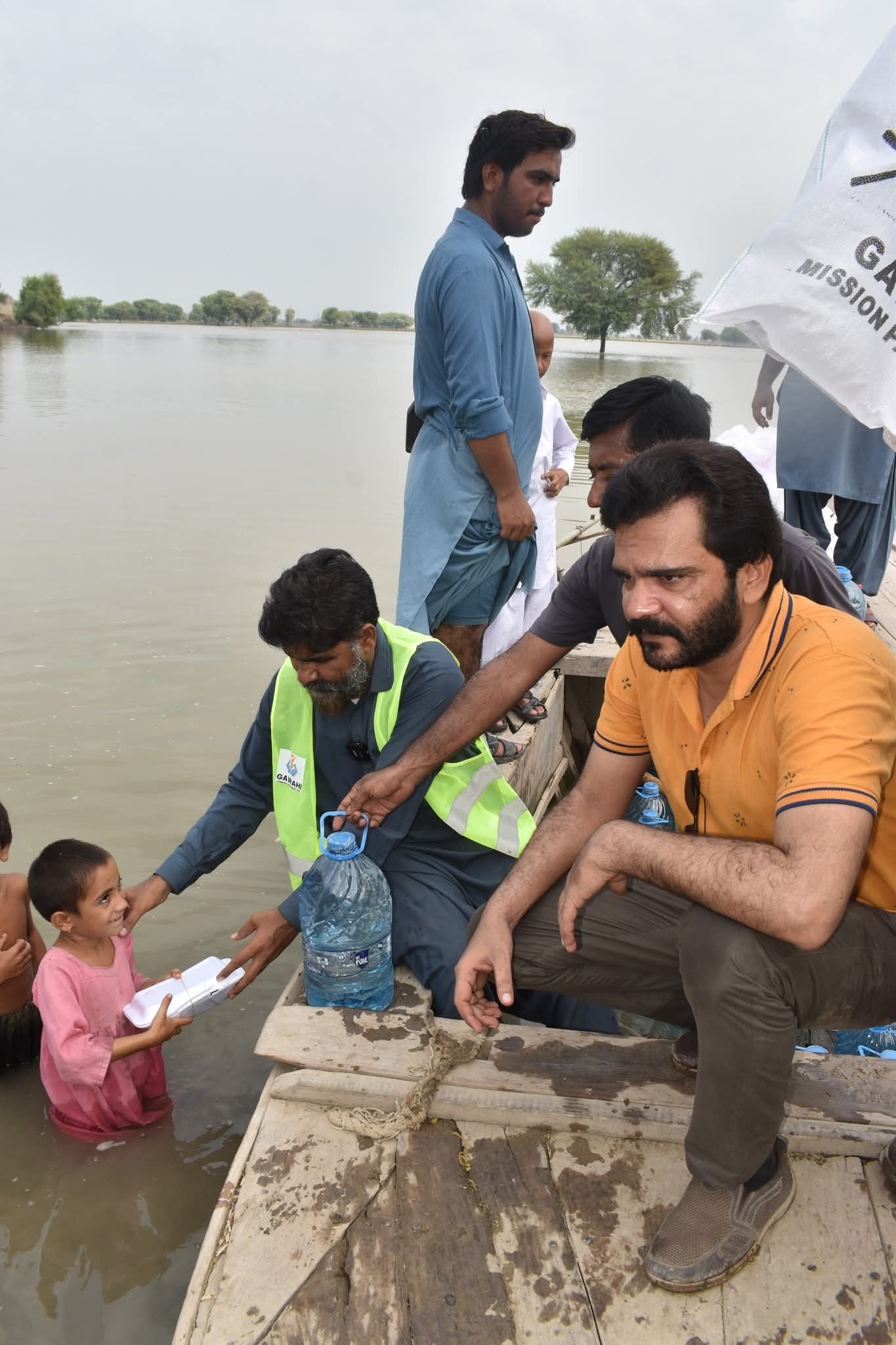 Boat teams reach cut-off villages with food and clean water