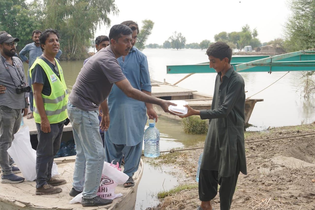 Delivering water bottles to flood-affected families