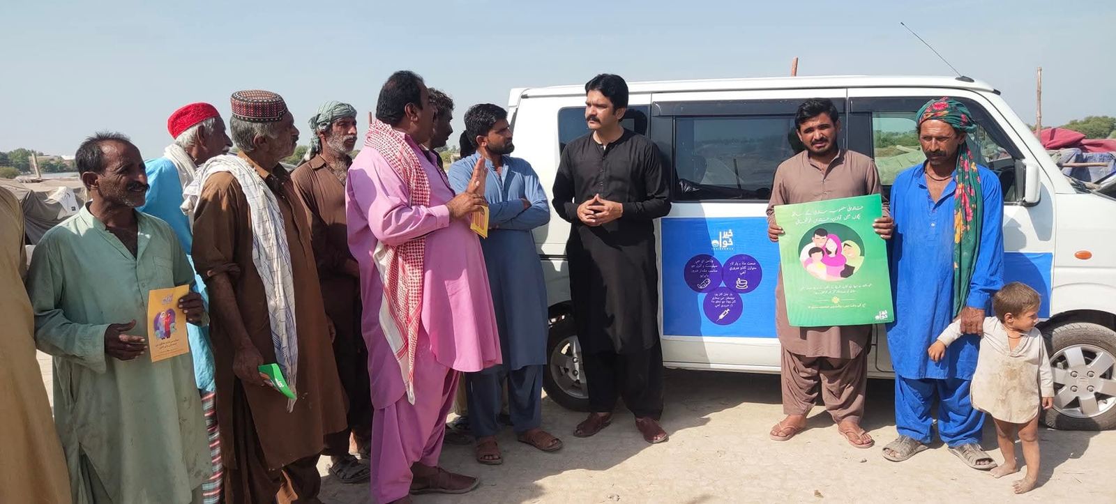 Community members engaging with the health awareness van