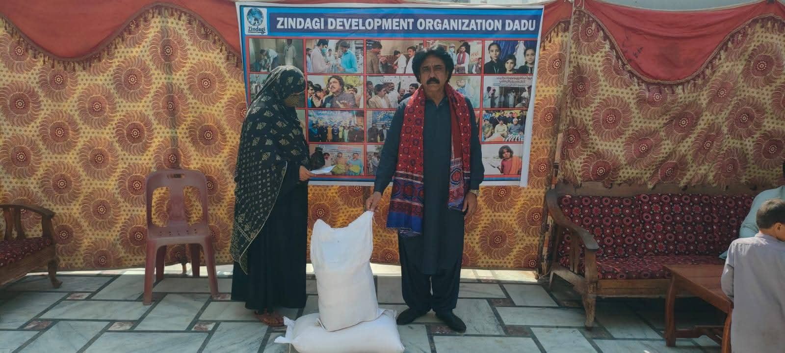 A woman receiving her household ration package