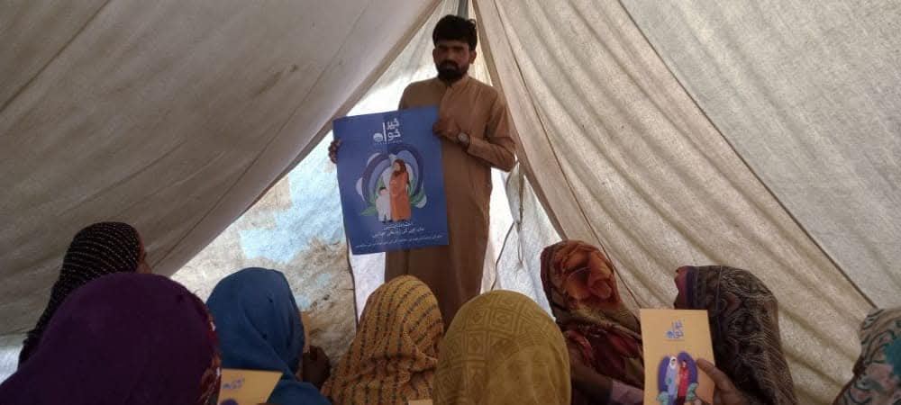 A volunteer leads a women's awareness circle