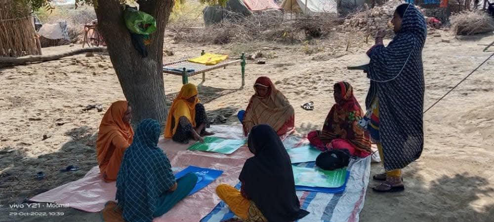 Women gathering for a community discussion
